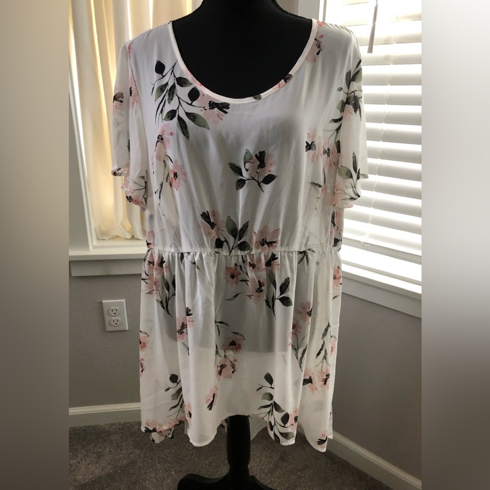 Creme color and pink floral blouse. High low hem short sleeves. Torrid size 2